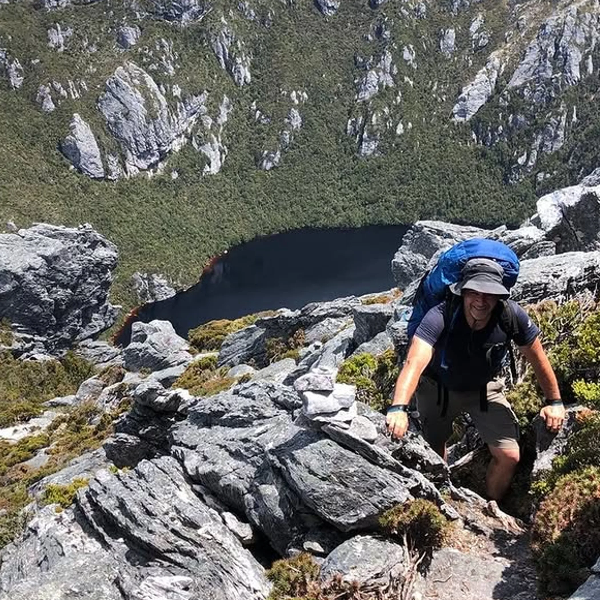 backpacker above remote swimming gorge